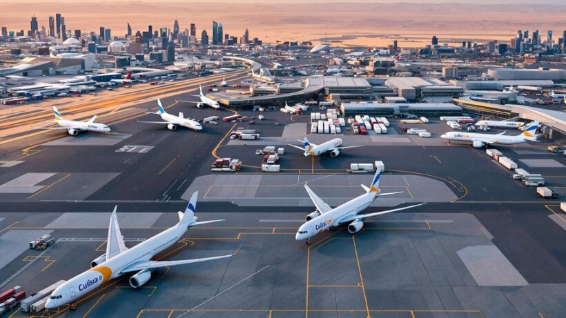 Cargo planes on runway at UAE airport.